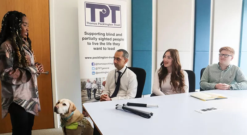 Standing blind woman being interviewed
